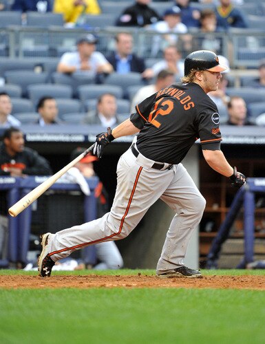 NEW YORK, NY - SEPTEMBER 07: Mark Reynolds #12 of the Baltimore Orioles connects for what would be the game winning single in the top of the eleventh inning against the New York Yankees on September 7, 2011 at Yankee Stadium in the Bronx borough of New York City. <br /><br /><span class="help">(Photo by Christopher Pasatieri/Getty Images)</span>