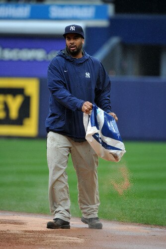 NEW YORK, NY - SEPTEMBER 07: A member of the New York Yankees grounds crew tends to the field in the middle of the sixth inning due to heavy rain during the game between the Baltimore Orioles and New York Yankees on September 7, 2011 at Yankee Stadium in the Bronx borough of New York City. <br /><br /><span class="help">(Photo by Christopher Pasatieri/Getty Images)</span>