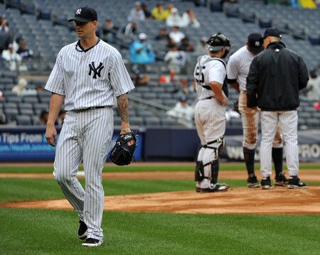 NEW YORK, NY - SEPTEMBER 07: A.J. Burnett #34 of the New York Yankees walks back to the dugout after being taken out of the game in the top of the seventh inning against the Baltimore Orioles and New York Yankees on September 7, 2011 at Yankee Stadium in the Bronx borough of New York City. <br /><br /><span class="help">(Photo by Christopher Pasatieri/Getty Images)</span>