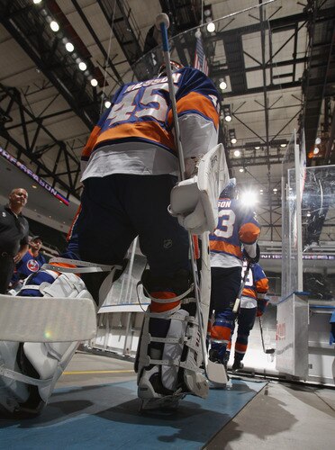 UNIONDALE, NY - SEPTEMBER 12: Anders Nilsson #45 of the New York Islanders heads out for warmups prior to his game against the Boston Bruins at the Nassau Coliseum on September 12, 2011 in Uniondale, New York.  <br /><br /><span class="help">(Photo by Bruce Bennett/Getty Images)</span>
