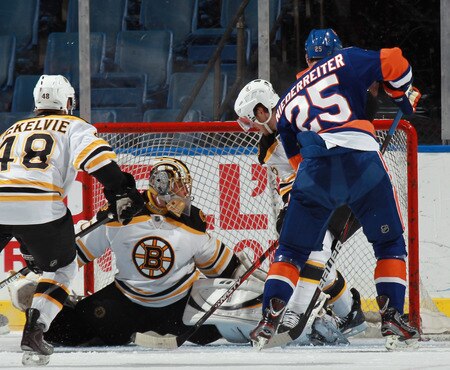 UNIONDALE, NY - SEPTEMBER 12: Nino Niederreiter #25 of the New York Islanders scores at 9:02 of the first period against Michael Hitchinson #70 of the Boston Bruins during a rookie game exhibition at Nassau Coliseum on September 12, 2011 in Uniondale, New York.  <br /><br /><span class="help">(Photo by Bruce Bennett/Getty Images)</span>