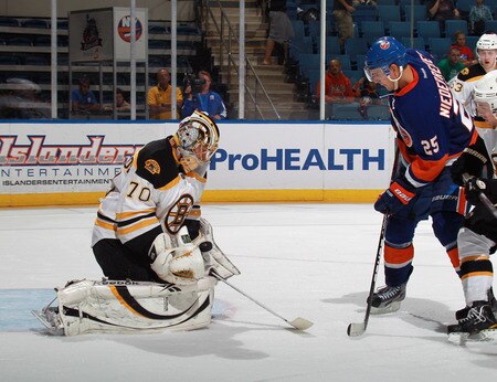 UNIONDALE, NY - SEPTEMBER 12: Nino Niederreiter #25 of the New York Islanders is stopped by Michael Hitchinson #70 of the Boston Bruins during a rookie game exhibition at Nassau Coliseum on September 12, 2011 in Uniondale, New York.  <br /><br /><span class="help">(Photo by Bruce Bennett/Getty Images)</span>