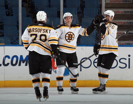 UNIONDALE, NY - SEPTEMBER 12: Ryan Spooner #51 (C) of the Boston Bruins scores a second period goal and is joined by David Warsofsky #79 (L) and Tyler Randell #66 (R) against the New York Islanders during a rookie game exhibition at Nassau Coliseum on September 12, 2011 in Uniondale, New York.  <br /><br /><span class="help">(Photo by Bruce Bennett/Getty Images)</span>