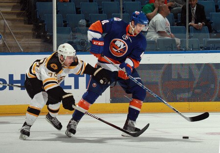UNIONDALE, NY - SEPTEMBER 12: David Warsofsky #79 of the Boston Bruins checks David Ullstrom #41 of the New York Islanders during a rookie game exhibition at Nassau Coliseum on September 12, 2011 in Uniondale, New York.  <br /><br /><span class="help">(Photo by Bruce Bennett/Getty Images)</span>