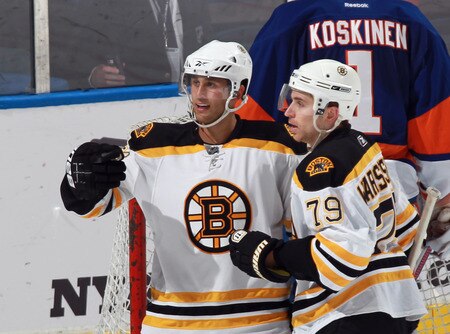 UNIONDALE, NY - SEPTEMBER 12: Carter Camper #58 (L) of the Boston Bruins scores at 18:06 of the third period against the New York Islanders and is joined by David Warsofsky #79 (R) during a rookie game exhibition at Nassau Coliseum on September 12, 2011 in Uniondale, New York. <br /><br /><span class="help">(Photo by Bruce Bennett/Getty Images)</span>