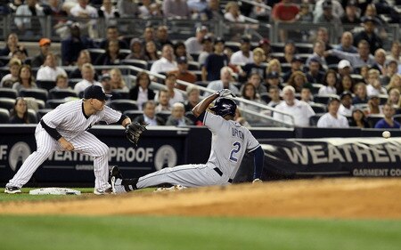 NEW YORK, NY - SEPTEMBER 22:  B.J. Upton #2 of the Tampa Bay Rays slides safely into third base on his second-inning RBI triple ahead of the throw to Brandon Laird #60 of the New York Yankees on September 22, 2011 at Yankee Stadium in the Bronx borough of New York City.  <br /><br /><span class="help">(Photo by Jim McIsaac/Getty Images)</span>