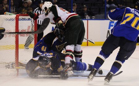 ST. LOUIS, MO - SEPTEMBER 22: Brett Bulmer #54 of the Minnesota Wild and Carlo Colaiacovo #28 of the St. Louis Blues slam into Jaroslav Halak #41at Scottrade Center on September 22, 2011 in St. Louis, Missouri.  <br /><br /><span class="help">(Photo by Jeff Curry/Getty Images)</span>