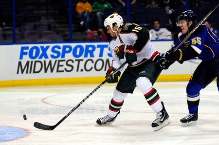 ST. LOUIS, MO - SEPTEMBER 22: Brad Staubitz #16 of the Minnesota Wild handles the puck as Danny Syvret #55 of the St. Louis Blues defends at Scottrade Center on September 22, 2011 in St. Louis, Missouri.  <br /><br /><span class="help">(Photo by Jeff Curry/Getty Images)</span>