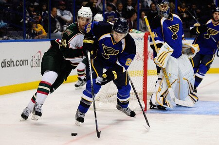 ST. LOUIS, MO - SEPTEMBER 22: Carlo Colaiacovo #28 of the St. Louis Blues handles the puck as Brett Bulmer #54 of the Minnesota Wild gives chase at Scottrade Center on September 22, 2011 in St. Louis, Missouri.  <br /><br /><span class="help">(Photo by Jeff Curry/Getty Images)</span>