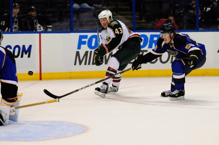 ST. LOUIS, MO - SEPTEMBER 22: Warren Peters #43 of the Minnesota Wild shoots and scores as Danny Syvret #55 of the St. Louis Blues attempts to block the shot at Scottrade Center on September 22, 2011 in St. Louis, Missouri.  <br /><br /><span class="help">(Photo by Jeff Curry/Getty Images)</span>