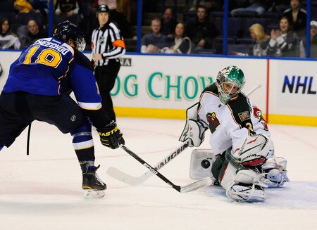 ST. LOUIS, MO - SEPTEMBER 22: Matt Hackett #31 of the Minnesota Wild defends against Jonathan Cheechoo #18 of the St. Louis Blues at Scottrade Center on September 22, 2011 in St. Louis, Missouri.  <br /><br /><span class="help">(Photo by Jeff Curry/Getty Images)</span>