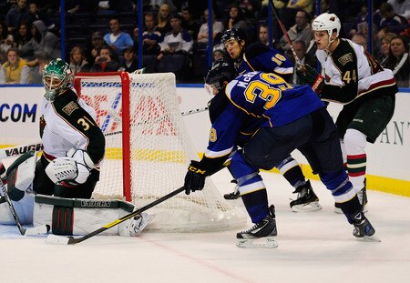 ST. LOUIS, MO - SEPTEMBER 22: Matt Hackett #31 of the Minnesota Wild defends against Philip McRae #39 of the St. Louis Blues at Scottrade Center on September 22, 2011 in St. Louis, Missouri.  <br /><br /><span class="help">(Photo by Jeff Curry/Getty Images)</span>