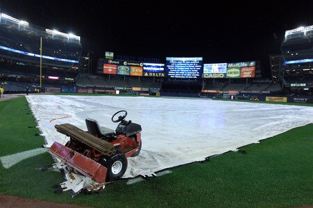 NEW YORK, NY - SEPTEMBER 23:  Rain falls as the game between the New York Yankees and the Boston Red Sox is postponed until Sunday on September 23, 2011 at Yankee Stadium in the Bronx borough of New York City.  <br /><br /><span class="help">(Photo by Nick Laham/Getty Images)</span>
