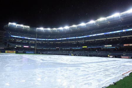 NEW YORK, NY - SEPTEMBER 23:  Rain falls as the game between the New York Yankees and the Boston Red Sox is postponed until Sunday on September 23, 2011 at Yankee Stadium in the Bronx borough of New York City.  <br /><br /><span class="help">(Photo by Nick Laham/Getty Images)</span>