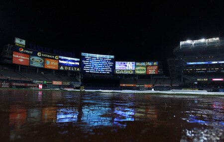 NEW YORK, NY - SEPTEMBER 23:  Rain falls as the game between the New York Yankees and the Boston Red Sox is postponed until Sunday on September 23, 2011 at Yankee Stadium in the Bronx borough of New York City.  <br /><br /><span class="help">(Photo by Nick Laham/Getty Images)</span>
