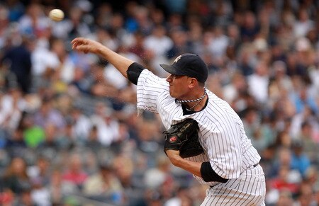 NEW YORK, NY - SEPTEMBER 24: Freddy Garcia #36 of the New York Yankees pitches against the Boston Red Sox on September 24, 2011 at Yankee Stadium in the Bronx borough of New York City.  <br /><br /><span class="help">(Photo by Nick Laham/Getty Images)</span>