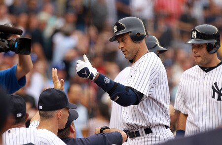 NEW YORK, NY - SEPTEMBER 24:  Derek Jeter #2 of the New York Yankees enters the dugout after hitting a three RBI home run in the second inning against the Boston Red Sox on September 24, 2011 at Yankee Stadium in the Bronx borough of New York City.  <br /><br /><span class="help">(Photo by Nick Laham/Getty Images)</span>