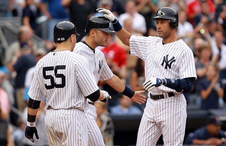 NEW YORK, NY - SEPTEMBER 24:  Derek Jeter #2 of the New York Yankees celebrates hitting a three RBI home run in the second inning with scoring runners Russell Martin #55 and Jesus Montero #63 against the Boston Red Sox on September 24, 2011 at Yankee Stadium in the Bronx borough of New York City.  <br /><br /><span class="help">(Photo by Nick Laham/Getty Images)</span>