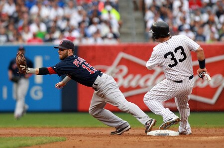 NEW YORK, NY - SEPTEMBER 24:  Nick Swisher #33 of the New York Yankees safely slides into second against Dustin Pedroia #15 of the Boston Red Sox on September 24, 2011 at Yankee Stadium in the Bronx borough of New York City.  <br /><br /><span class="help">(Photo by Nick Laham/Getty Images)</span>