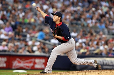 NEW YORK, NY - SEPTEMBER 24: Junichi Tazawa #63 of the Boston Red Sox pitches against the New York Yankees on September 24, 2011 at Yankee Stadium in the Bronx borough of New York City.  <br /><br /><span class="help">(Photo by Nick Laham/Getty Images)</span>