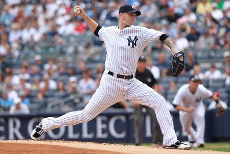 NEW YORK, NY - SEPTEMBER 25: A.J. Burnett #34 of the New York Yankees pitches against the Boston Red Sox on September 25, 2011 at Yankee Stadium in the Bronx borough of New York City.  <br /><br /><span class="help">(Photo by Nick Laham/Getty Images)</span>