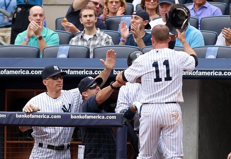 NEW YORK, NY - SEPTEMBER 25: Brett Gardner #11 of the New York Yankees is congratulated after scoring on a Tim Wakefield #49 of the Boston Red Sox wild pitch on September 25, 2011 at Yankee Stadium in the Bronx borough of New York City.  <br /><br /><span class="help">(Photo by Nick Laham/Getty Images)</span>