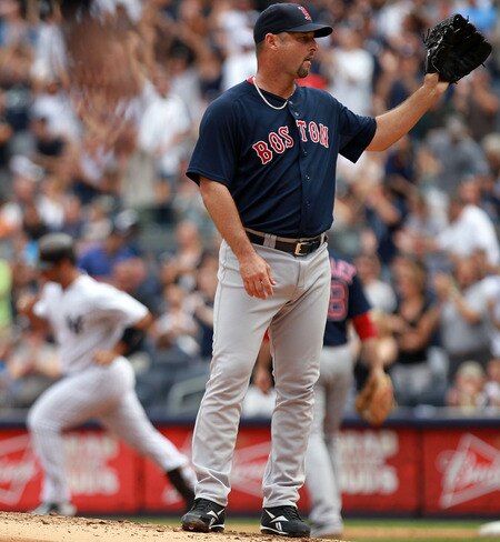 NEW YORK, NY - SEPTEMBER 25:  Tim Wakefield #49 of the Boston Red Sox on the mound as Jorge Posada #20 of the New York Yankees rounds the bases after his two RBI home run on September 25, 2011 at Yankee Stadium in the Bronx borough of New York City.  <br /><br /><span class="help">(Photo by Nick Laham/Getty Images)</span>