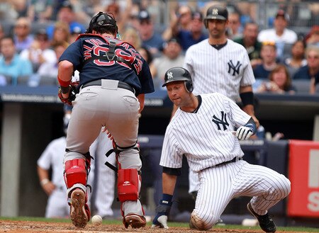 NEW YORK, NY - SEPTEMBER 25:  Derek Jeter #2 of the New York Yankees slides safely into home despite the tag attempt from Jarrod Saltalamacchia #39 of the Boston Red Sox on September 25, 2011 at Yankee Stadium in the Bronx borough of New York City.  <br /><br /><span class="help">(Photo by Nick Laham/Getty Images)</span>