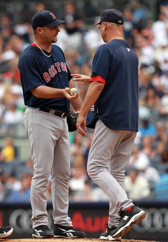 NEW YORK, NY - SEPTEMBER 25:  Tim Wakefield #49 of the Boston Red Sox is pulled from the game by manager Terry Francona #47 in the fifth inning against the New York Yankees on September 25, 2011 at Yankee Stadium in the Bronx borough of New York City.  <br /><br /><span class="help">(Photo by Nick Laham/Getty Images)</span>
