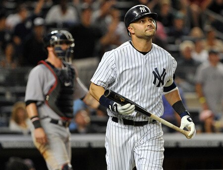 NEW YORK, NY - SEPTEMBER 25: Nick Swisher #33 of the New York Yankees flies out to right in the bottom of the 13th inning against the Boston Red Sox on September 25, 2011 at Yankee Stadium in the Bronx borough of New York City. <br /><br /><span class="help">(Photo by Christopher Pasatieri/Getty Images)</span>