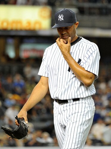 NEW YORK, NY - SEPTEMBER 25: Mariano Rivera #42 of the New York Yankees reacts as he walks back to the dugout after pitching the top of the ninth inning against the Boston Red Sox on September 25, 2011 at Yankee Stadium in the Bronx borough of New York City. <br /><br /><span class="help">(Photo by Christopher Pasatieri/Getty Images)</span>