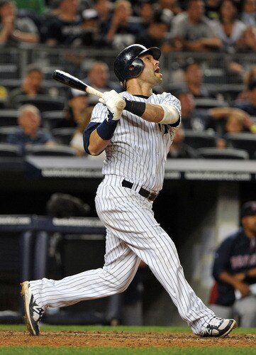 NEW YORK, NY - SEPTEMBER 25: Nick Swisher #33 of the New York Yankees flies out to left in the bottom of the 11th inning against the Boston Red Sox on September 25, 2011 at Yankee Stadium in the Bronx borough of New York City. <br /><br /><span class="help">(Photo by Christopher Pasatieri/Getty Images)</span>