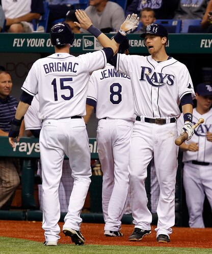 ST. PETERSBURG, FL - SEPTEMBER 26:  Infielder Ben Zobrist #18 of the Tampa Bay Rays congratulates Reid Brignac #15 after he scores against the New York Yankees during the game at Tropicana Field on September 26, 2011 in St. Petersburg, Florida.  <br /><br /><span class="help">(Photo by J. Meric/Getty Images)</span>