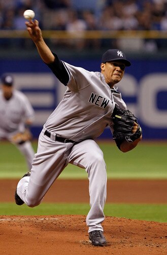 ST PETERSBURG, FL - SEPTEMBER 26:  Pitcher Hector Noesi #64 of the New York Yankees pitches against the Tampa Bay Rays during the game at Tropicana Field on September 26, 2011 in St. Petersburg, Florida.  <br /><br /><span class="help">(Photo by J. Meric/Getty Images)</span>