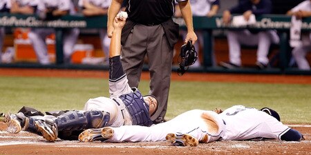 ST PETERSBURG, FL - SEPTEMBER 26:  Catcher Russell Martin #55 of the New York Yankees shows the umpire the ball after the tag on Evan Longoria #3 of the Tampa Bay Rays during the game at Tropicana Field on September 26, 2011 in St. Petersburg, Florida.  <br /><br /><span class="help">(Photo by J. Meric/Getty Images)</span>