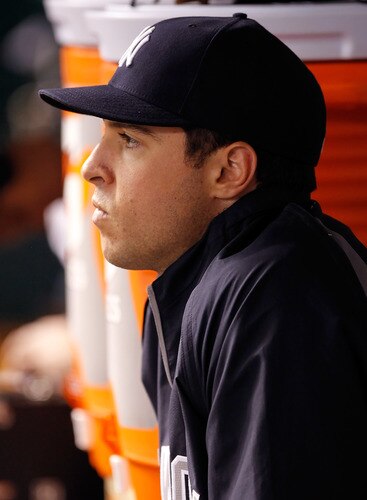 ST. PETERSBURG, FL - SEPTEMBER 26:  Infielder Mark Teixeira #25 of the New York Yankees watches his team against the Tampa Bay Rays during the game at Tropicana Field on September 26, 2011 in St. Petersburg, Florida.  <br /><br /><span class="help">(Photo by J. Meric/Getty Images)</span>