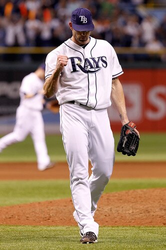 ST. PETERSBURG, FL - SEPTEMBER 26:  Pitcher Kyle Farnsworth #43 of the Tampa Bay Rays pumps his fist after getting the last out against the New York Yankees at Tropicana Field on September 26, 2011 in St. Petersburg, Florida.  <br /><br /><span class="help">(Photo by J. Meric/Getty Images)</span>