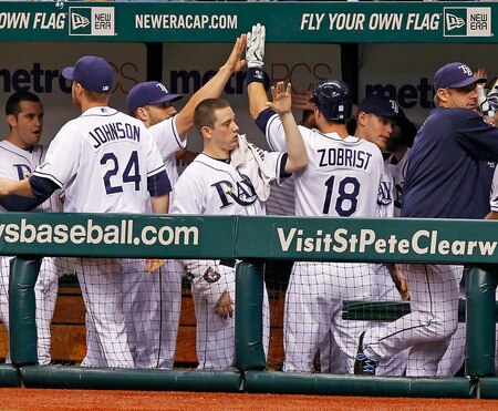 ST. PETERSBURG, FL - SEPTEMBER 27:  Infielder Ben Zobrist #18 of the Tampa Bay Rays is congratulated after this home run against the New York Yankees during the game at Tropicana Field on September 27, 2011 in St. Petersburg, Florida.  <br /><br /><span class="help">(Photo by J. Meric/Getty Images)</span>