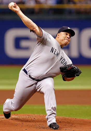 ST PETERSBURG, FL - SEPTEMBER 27:  Pitcher Bartolo Colon #40 of the New York Yankees pitches against the Tampa Bay Rays during the game at Tropicana Field on September 27, 2011 in St. Petersburg, Florida.  <br /><br /><span class="help">(Photo by J. Meric/Getty Images)</span>
