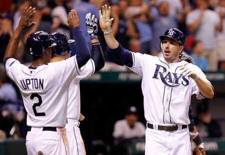 ST. PETERSBURG, FL - SEPTEMBER 27:  B.J. Upton #2 and Evan Longoria #3 of the Tampa Bay Rays congratulate Matt Joyce #20 after his three run home run against the New York Yankees during the game at Tropicana Field on September 27, 2011 in St. Petersburg, Florida.  <br /><br /><span class="help">(Photo by J. Meric/Getty Images)</span>