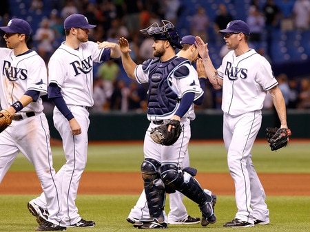 ST. PETERSBURG, FL - SEPTEMBER 27:  Catcher Kelly Shoppach #10 and pitcher Kyle Farnsworth #43 of the Tampa Bay Rays celebrate their team's victory over the New York Yankees at Tropicana Field on September 27, 2011 in St. Petersburg, Florida.  <br /><br /><span class="help">(Photo by J. Meric/Getty Images)</span>