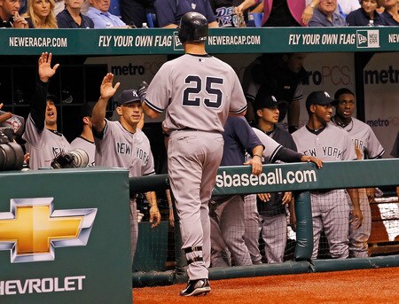 ST PETERSBURG, FL - SEPTEMBER 28:  Mark Teixeira #25 of the New York Yankees is congratulated by manager Joe Girardi after hitting a grand slam home run against the Tampa Bay Rays during the game at Tropicana Field on September 28, 2011 in St. Petersburg, Florida.  <br /><br /><span class="help">(Photo by J. Meric/Getty Images)</span>