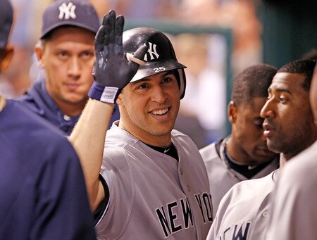 ST. PETERSBURG, FL - SEPTEMBER 28:  Infielder Mark Teixeira #25 of the New York Yankees celebrates his second home run of the night against the Tampa Bay Rays during the game at Tropicana Field on September 28, 2011 in St. Petersburg, Florida.  <br /><br /><span class="help">(Photo by J. Meric/Getty Images)</span>