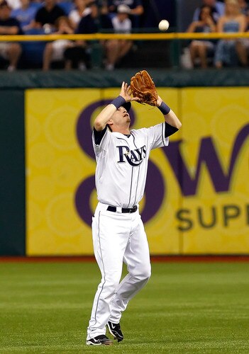 ST. PETERSBURG, FL - SEPTEMBER 28:  Infielder Reid Brignac #15 of the Tampa Bay Rays catches a fly ball against the New York Yankees during the game at Tropicana Field on September 28, 2011 in St. Petersburg, Florida.  <br /><br /><span class="help">(Photo by J. Meric/Getty Images)</span>