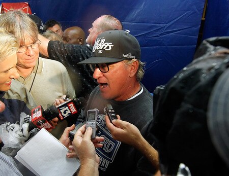 ST. PETERSBURG, FL - SEPTEMBER 28:  Manager Joe Maddon #70 of the Tampa Bay Rays talks with the media in the locker room just after the game against the New York Yankees at Tropicana Field on September 28, 2011 in St. Petersburg, Florida.  <br /><br /><span class="help">(Photo by J. Meric/Getty Images)</span>