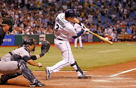 ST PETERSBURG, FL - SEPTEMBER 28:  Evan Longoria #3 of the Tampa Bay Rays hits a walk-off home run in the bottom of the twelfth inning against the New York Yankees during the game at Tropicana Field on September 28, 2011 in St. Petersburg, Florida.  <br /><br /><span class="help">(Photo by J. Meric/Getty Images)</span>