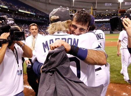 ST. PETERSBURG, FL - SEPTEMBER 28:  Manager Joe Maddon #70 of the Tampa Bay Rays hugs Sean Rodriguez #1 after the Rays victory over the New York Yankees at Tropicana Field on September 28, 2011 in St. Petersburg, Florida.  <br /><br /><span class="help">(Photo by J. Meric/Getty Images)</span>