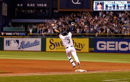 ST PETERSBURG, FL - SEPTEMBER 28:  Infielder Evan Longoria #3 of the Tampa Bay Rays rounds the bases after his bottom of the twelveth inning walk off home run against the New York Yankees during the game at Tropicana Field on September 28, 2011 in St. Petersburg, Florida.  <br /><br /><span class="help">(Photo by J. Meric/Getty Images)</span>