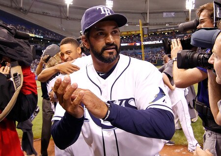 ST PETERSBURG, FL - SEPTEMBER 28:  Bench coach Dave Martinez #4 of the Tampa Bay Rays celebrates the Rays victory over the New York Yankees at Tropicana Field on September 28, 2011 in St. Petersburg, Florida.  <br /><br /><span class="help">(Photo by J. Meric/Getty Images)</span>