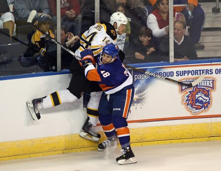 BRIDGEPORT, CT - OCTOBER 01:  Michael Haley #18 of the New York Islanders boards Joe Corvo #14 of the Boston Bruins at the Webster Bank Arena on October 1, 2011 in Bridgeport, Connecticut.  <br /><br /><span class="help">(Photo by Bruce Bennett/Getty Images)</span>